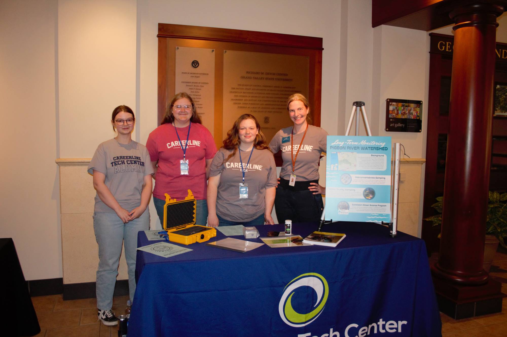 Careerline Tech Center teacher with her students at their display table indoors